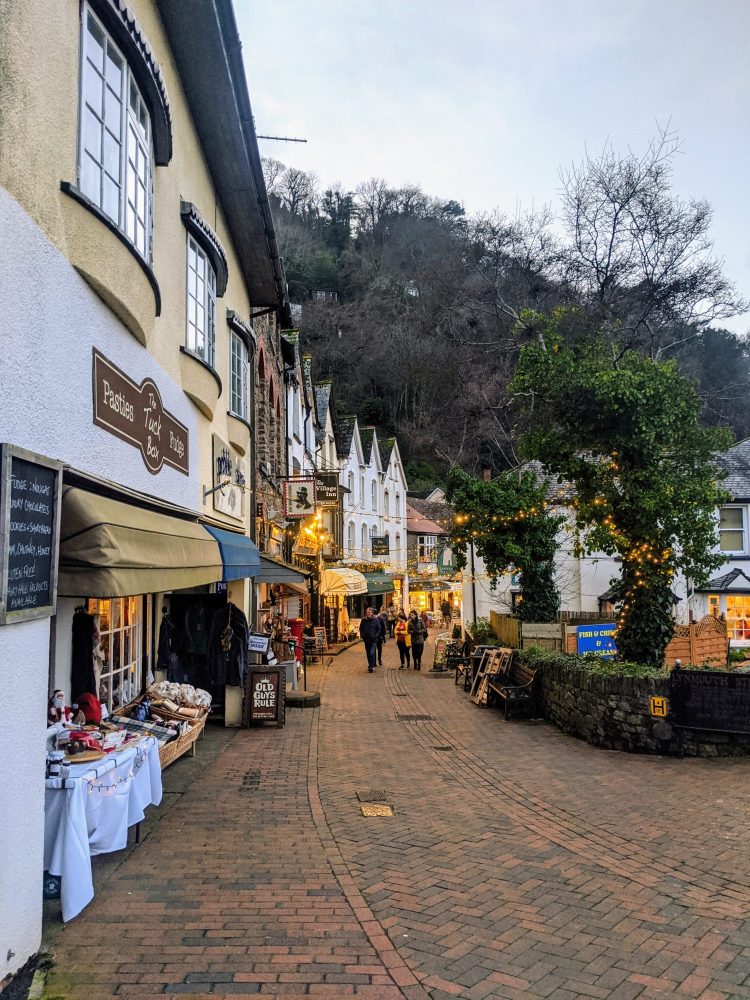 High street of shops with late night Christmas shopping