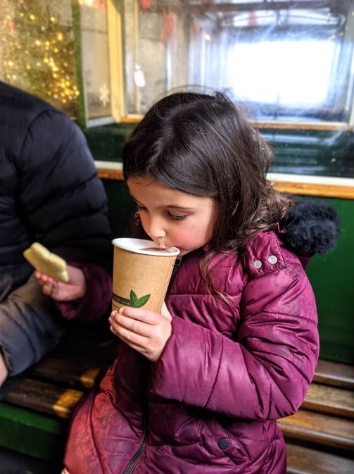Child eating a Christmas cookie at The Milky Way adventure park in Bideford