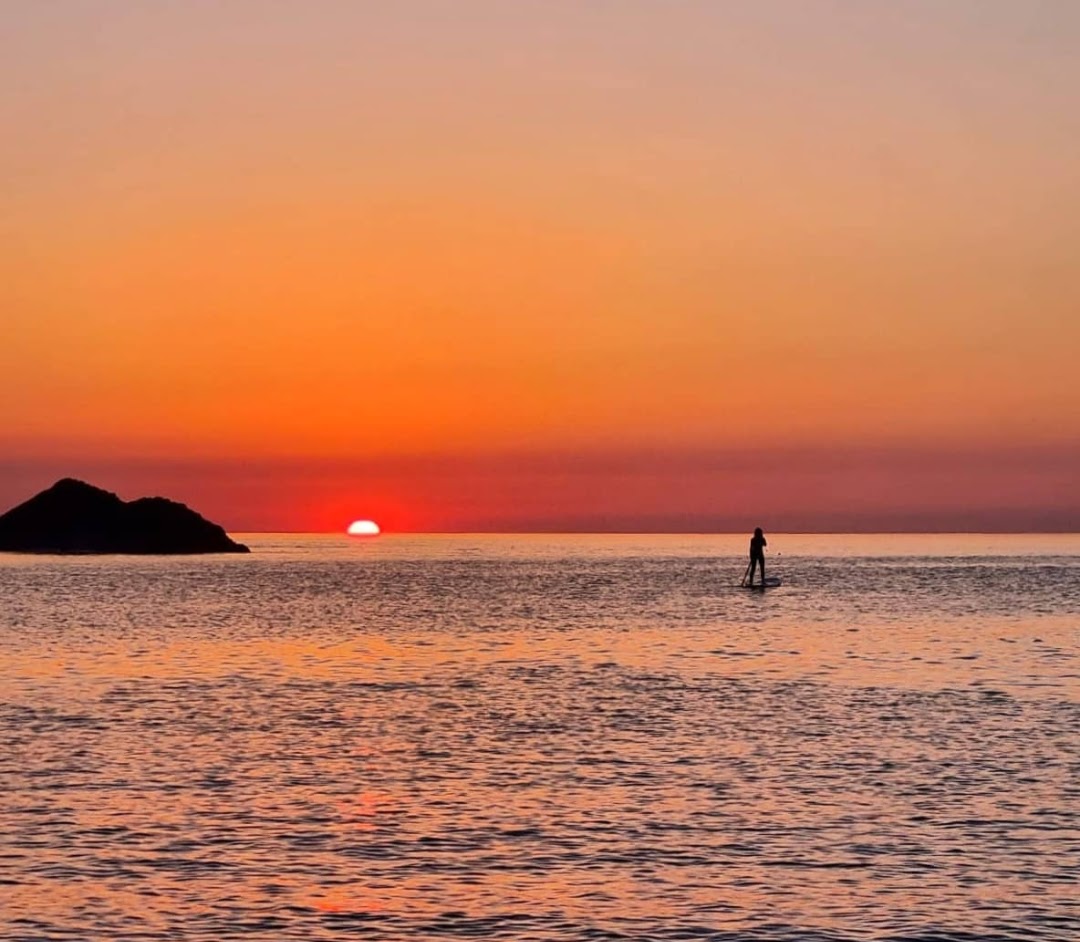 Paddleboarding in North Devon while the sun sets